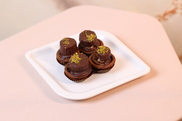 chocolate candies on white plate