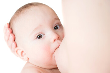 Little baby boy breast feeding, isolated on white background