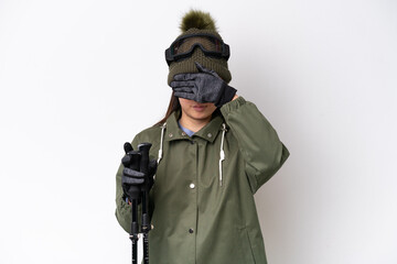 Young Chinese woman wearing winter jacket isolated on white background covering eyes by hands. Do not want to see something