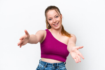 Young caucasian girl isolated on white background presenting and inviting to come with hand