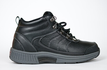 Black women's leather winter sneakers with laces.