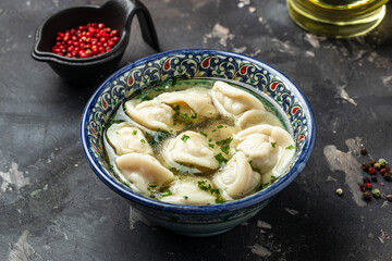 Dumplings in the soup chuchvara, Manti with lamb meat. Uzbek cuisine, banner, menu, recipe place for text, top view