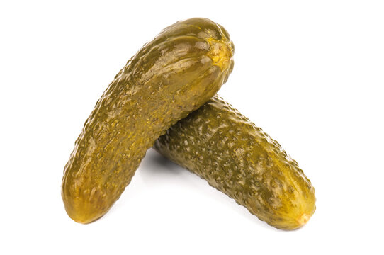 two marinated picles cucumbers on white background