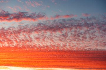 Beautiful burning clouds under the afternoon sunset