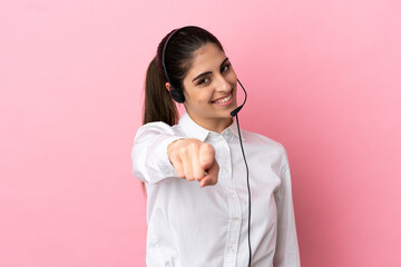 Young telemarketer over isolated background pointing front with happy expression