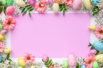 Fototapeta na wymiar Colorful eggs with flowers on a white and pink background. Easter design in pastel colors with space for text. Holiday template, top view.