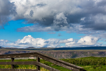 Observation point deck view with partial wooden fence, Southern Iceland, travel in the summer