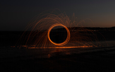Burning wire wool image, light trails at night 