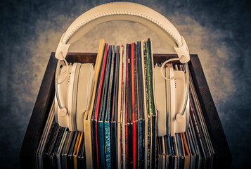 Vinyl records and headphones in retro style