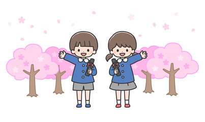 卒園式　桜の前に並んで立つ男の子と女の子