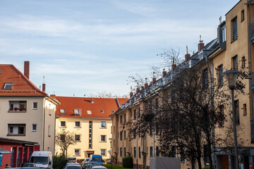 Typical facades of  multistorey residential buildings in a suburban street of Cologne, germany, in...