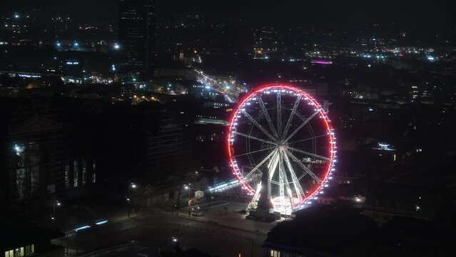 The big wheel of Brussels viewed from above in a 4k night video time lapse. Landmarks of Brussels. 