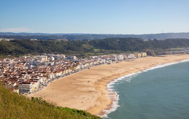 Landscape of the empty beach in Nazare - Portugal