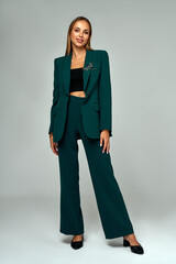 Fashionable elegant woman wear stylish clothes shawl lapel blazer and long flowing trousers...