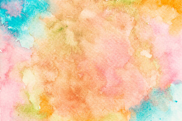 Blue, orange, green, pink, red and yellow watercolor paint on paper design element.