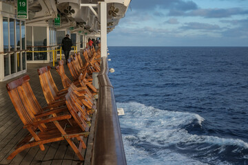 Teak Deck chairs and sun loungers on outdoor balcony terrace patio deck of luxury on legendary...