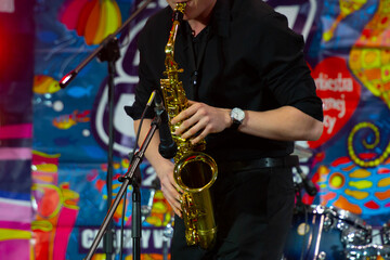 musician playing saxophone on stage
