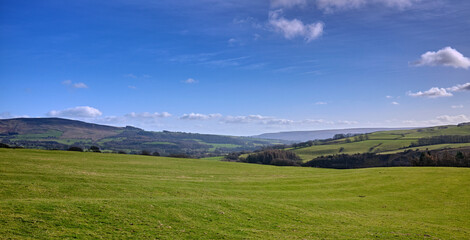Fototapeta na wymiar February and under a sunny blue sky, a view across the landscape at Halton East. North Yorkshire