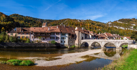 Saint Ursanne, Switzerland - October 19, 2021: Picturesque medieval town of Saint Ursanne in the swiss canton of Jura in autumn