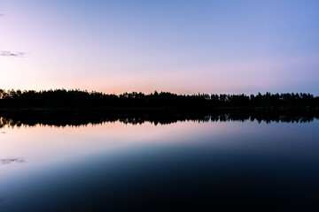 Fototapeta premium Sunset over a beautiful lake in Sweden