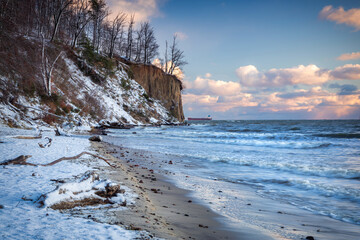 Beautiful landscape of the cliff in Gdynia Orłowo in snowy winter, Baltic Sea. Poland