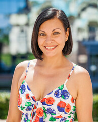 Beautiful brunette middle aged woman in summer dress