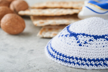 Passover celebration concept. Matzah, red kosher and walnut. Traditional ritual Jewish bread...