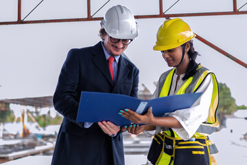 Site manager walk down with engineer to check precast ready made concrete panel work progress