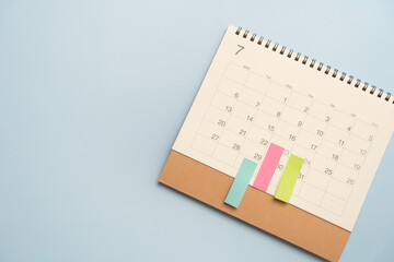 close up of calendar on the blue table background, planning for business meeting or travel planning...