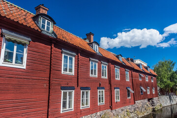 Colorful houses by the canal in the city center of Vasteras, Sweden