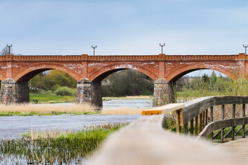 Fototapeta na wymiar old red brick bridge in Latvia