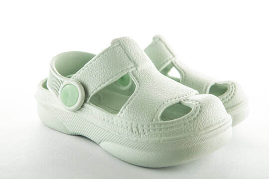 image of baby rubber shoes white background
