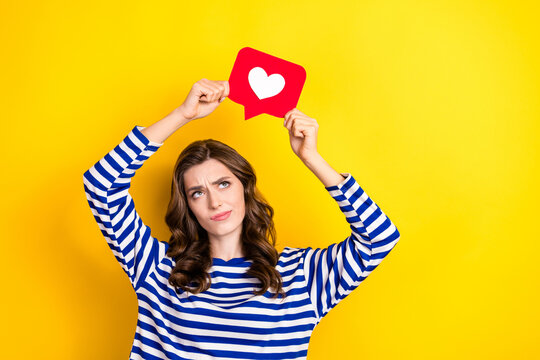 Photo of young funny grimace pouted lips minded woman popular blogger look curious like paper symbol notification isolated on yellow color background