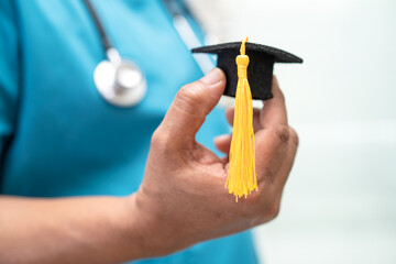 Asian doctor study learn with graduation gap hat in hospital ward, clever bright genius education...
