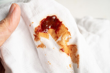 Dirty tomato sauce stain or ketchup on cloth to wash with washing powder, cleaning housework...