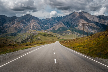 Naklejka premium View along Highway 73 near the Cave Stream Scenic Reserve looking towards the Castle Hill Peak on the South Island of New Zealand