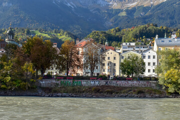 Fototapeta na wymiar Panoramic view of the historic city center of Innsbruck with colorful houses along Inn river.