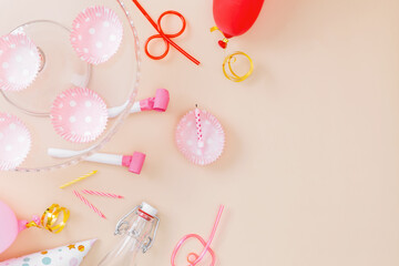 Preparing for birthday party. Attributes of holiday on pink background. Top view. Copy space