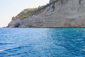 View of the rocky shore from the sea. Mediterranean Sea in Turkey. Popular tourist places. Background