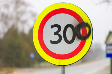 The vandals painted the number zero on a road sign with a speed limit of 30 kilometers per hour