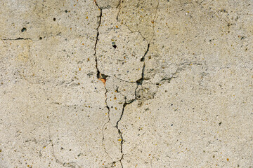 Rough textured cement wall surface with crack. Backdrop, graphic resource. Texture background