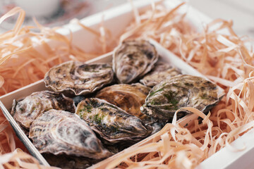 Closed oysters in a delivery box 
