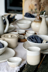 Rustic table setting with empty craft handmade ceramic tableware