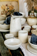 Rustic table setting with empty craft handmade ceramic tableware
