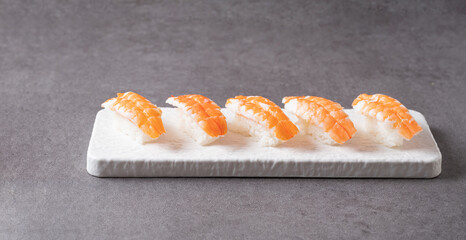 Shrimp sushi on a stone plate