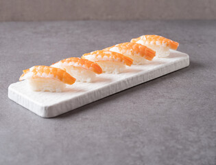 Shrimp sushi on a stone plate