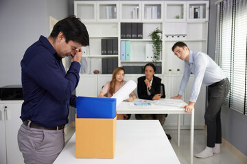 businessman feeling sad when he losing a job and left the office