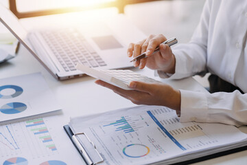 Hand holding car keys and car rental concept A close-up view of the agent, giving the customer the...