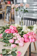 Florist prepares flowers. Fresh delivery in flower shop. European floral shop. Delivery fresh cut flower.