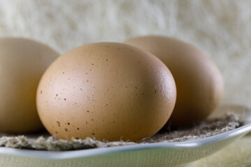Three boiled eggs are on a plate